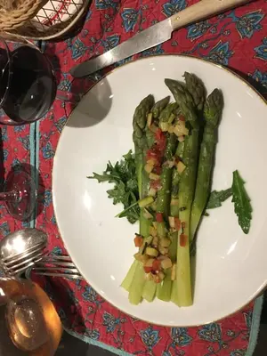 a plate of food with vegetables on a table at La Bergerie Pradel in Le Beaucet