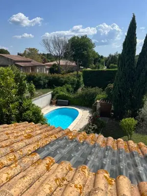 a view from the roof of a house with a swimming pool at L'Isle en coeur air-conditioned house with garden and swimming pool in LʼIsle-sur-la-Sorgue