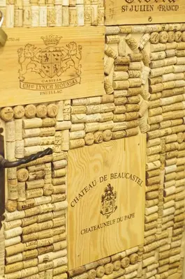 a wooden wall with two signs on it at Gite Fa Mille maison bleu in Robion en Luberon