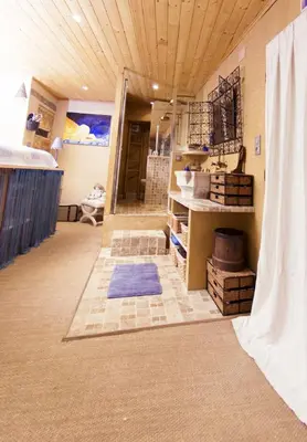 a large bathroom with a tub and a sink at Gite Fa Mille maison bleu in Robion en Luberon