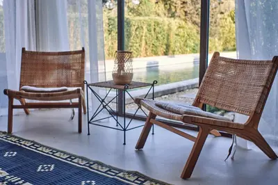 two chairs and a table in a room with a window at Le Mas de Cink in Saint-Saturnin-les-Apt