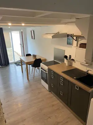 a kitchen and dining room with a table and a kitchen at Studio 1 personne Vaucluse in Carpentras