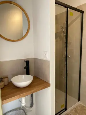 a bathroom with a sink and a shower at Le studio de Marie in Noves