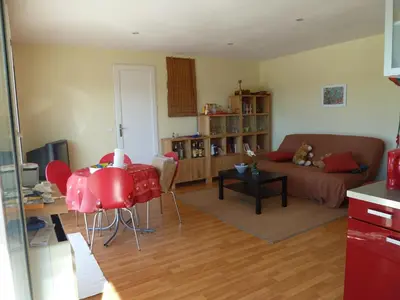 a living room with a couch and a table at Iris Caromb in Caromb
