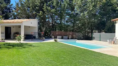 a yard with a swimming pool and a house at 3 bedroom villa with pool in Aix-en-Provence
