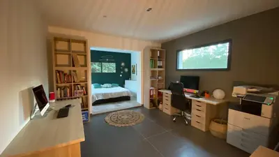 a room with a bedroom with a bed and a desk at 3 bedroom villa with pool in Aix-en-Provence