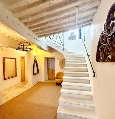a stairway in a building with a stair case at Roussillon House in Roussillon