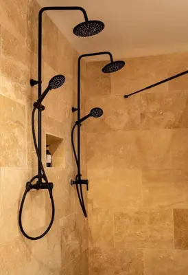 a shower with two shower heads in a bathroom at AMA, suite avec baignoire balnéo et sauna privé in Avignon