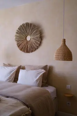 a bedroom with two beds and a mirror on the wall at AMA, suite avec baignoire balnéo et sauna privé in Avignon