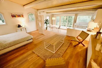 a bedroom with a bed and a desk in a room at L'Observateur in Aix-en-Provence