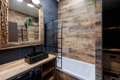 a bathroom with a tub and a sink and a mirror at Duplex Factory II Hyper Centre in Salon-de-Provence