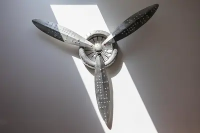 a ceiling fan is attached to a white wall at Duplex Factory II Hyper Centre in Salon-de-Provence