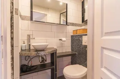 a bathroom with a toilet and a sink at Finsonius Studios in Aix-en-Provence
