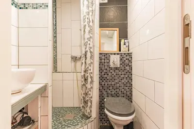 a bathroom with a toilet and a sink at Finsonius Studios in Aix-en-Provence