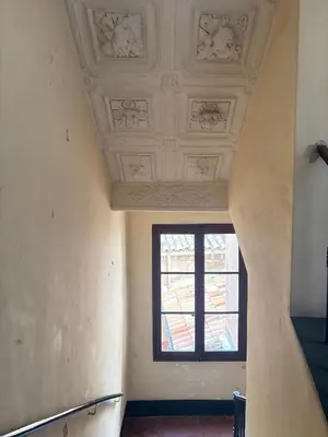 a hallway with a window and a ceiling at L Appart Aixois in Aix-en-Provence