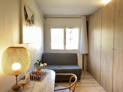 a living room with a couch and a table at Les Cerisiers in Aix-en-Provence