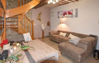 a living room with a couch and a table at 2 Bedroom Lovely Home In Vedène in Vedène