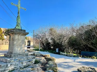 a statue of a cross on a stone monument at Lou Miradou 2 - Vieux village médiéval, Cosy, Clim, 2 personnes in Miramas