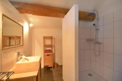 a bathroom with a sink and a shower at Le domaine de Villemus chambre d'hote in Jouques