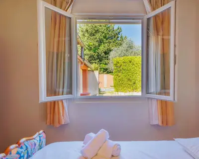 an open window with a view of a room at Villa provençale avec piscine privée et jardin ensoleillé in Mollégès