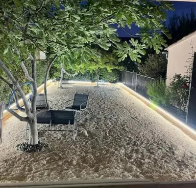 a couple of chairs sitting next to a tree at Gîte La Chouette Hulotte classé 3 étoiles Spa, Mt Ventoux, Parc Spirou in Flassan