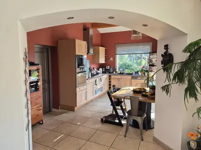 a kitchen with a table and a dining room at Villa 170m2 avec piscine près d Aix en provence 7 couchages in Éguilles