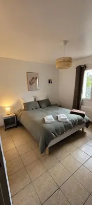 a bedroom with a large bed in a room at Charming villa with a pool in Cadenet