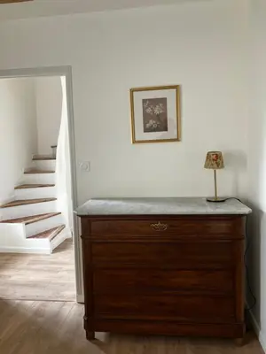 a dresser with a lamp on top of it in a room at MaisonAdèle in Caromb