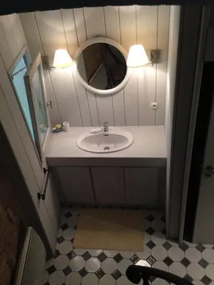 a bathroom with a sink and a mirror at Campanina in Bonnieux