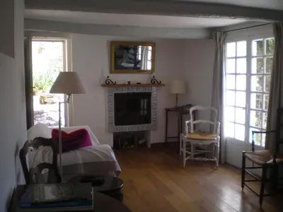 a living room with a couch and a fireplace at Campanina in Bonnieux