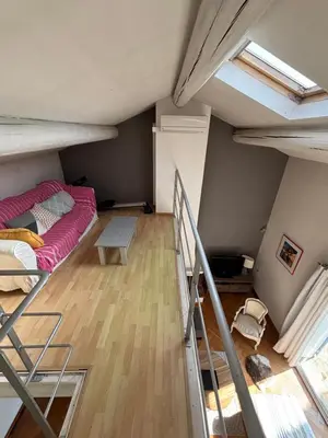 a room with a bunk bed and a ladder at Mas de charme provencal in Cavaillon