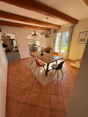 a kitchen and dining room with a table and chairs at Mas de charme provencal in Cavaillon