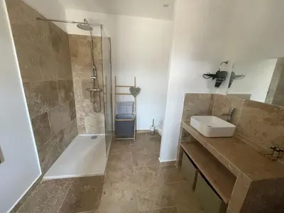 a bathroom with a shower and a sink and a tub at La l isloise in LʼIsle-sur-la-Sorgue