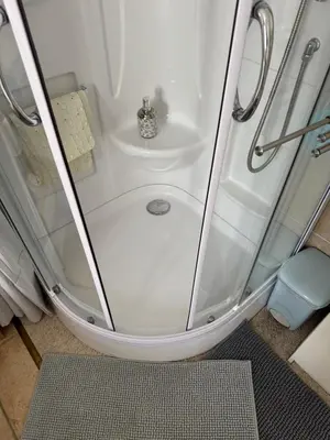 a shower with a glass door in a bathroom at Chez DOMI in LʼIsle-sur-la-Sorgue