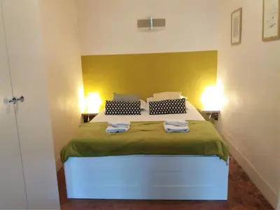 a bedroom with a bed with two towels on it at Gorgeous! heart of Aix en Provence appartement climatisé in Aix-en-Provence
