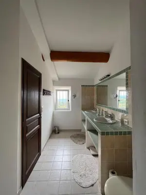 a bathroom with a sink and a mirror at Le Mas de Quatremonts - Your refuge in Provence in Bonnieux