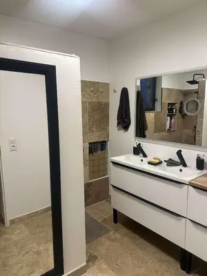 a bathroom with a sink and a mirror at charmante petite maison - piscine hors sol - proche Avignon in Avignon
