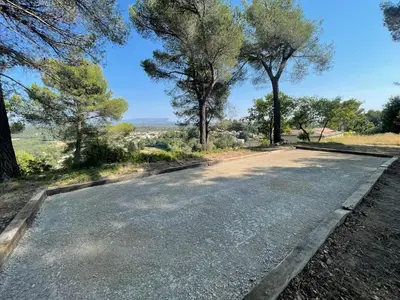 an empty road with trees on either side at Grande maison de famille rénovée, vue sur Sainte Victoire in Venelles