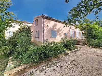 a house with a lot of plants in front of it at Grande maison de famille rénovée, vue sur Sainte Victoire in Venelles