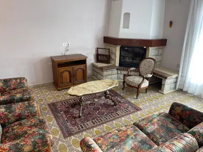 a living room with a couch and a fireplace at Grand Appartement Provençal in Manosque