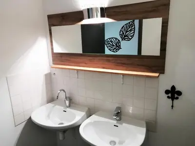 a bathroom with a sink and a mirror at La Roselière in Mérindol