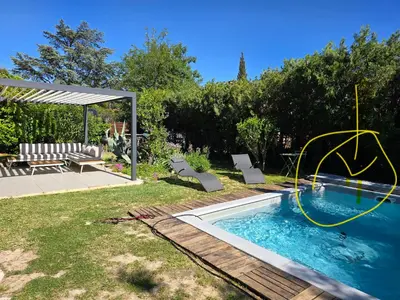 a backyard with a swimming pool with a gazebo at Maison Climatisée, Jardin, Piscine, 7 pers in Salon-de-Provence