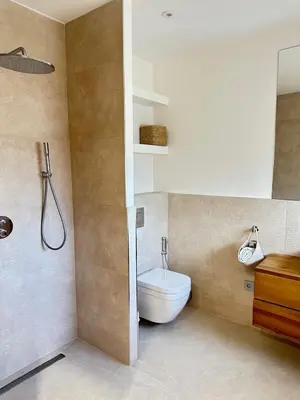 a bathroom with a toilet and a sink at Le Grand Bouteillan in Pierrevert