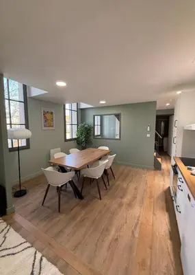 a kitchen and dining room with a table and chairs at T4 d'exception à Aix in Aix-en-Provence