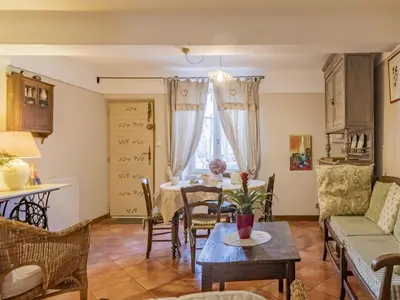 a living room with a table and a dining room at Holiday Home Côté Place by Interhome in Villars