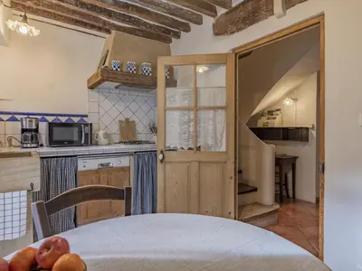 a kitchen with a table and a counter top at Holiday Home Côté Place by Interhome in Villars