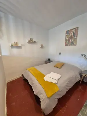 a bedroom with a bed with towels on it at Cosy downtown studio in Apt