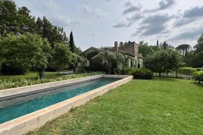 a swimming pool in the yard of a house at Holiday Home in Lourmarin Stunning View of the Château in Lourmarin