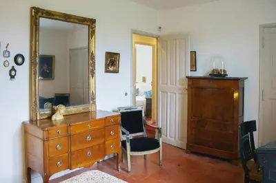 a room with a dresser and a mirror at Holiday Home in Lourmarin Stunning View of the Château in Lourmarin