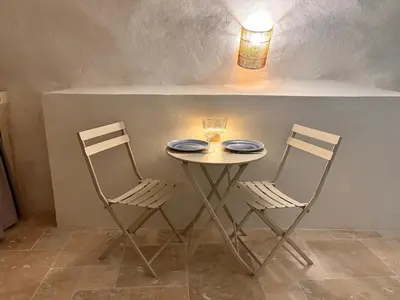 a shower in a bathroom with a blue light at Les Caves d 'Oía in Aix-en-Provence
